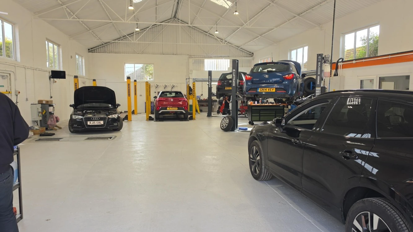 Cars on the ramps in the Best Garages workshop